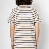 Person wearing a striped t-shirt against a plain background