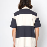 Person wearing a black and white striped shirt on a white background