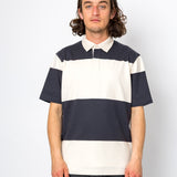 Man wearing a striped polo shirt against a white background