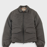 Gray jacket with plaid lining and visible brand name on a white background