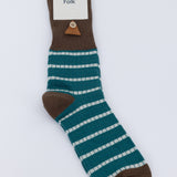 Brown and blue striped sock against a grey background
