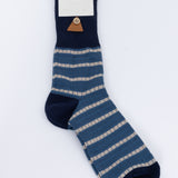 Navy blue sock with beige stripes on a white background, featuring 'Folk' brand label.