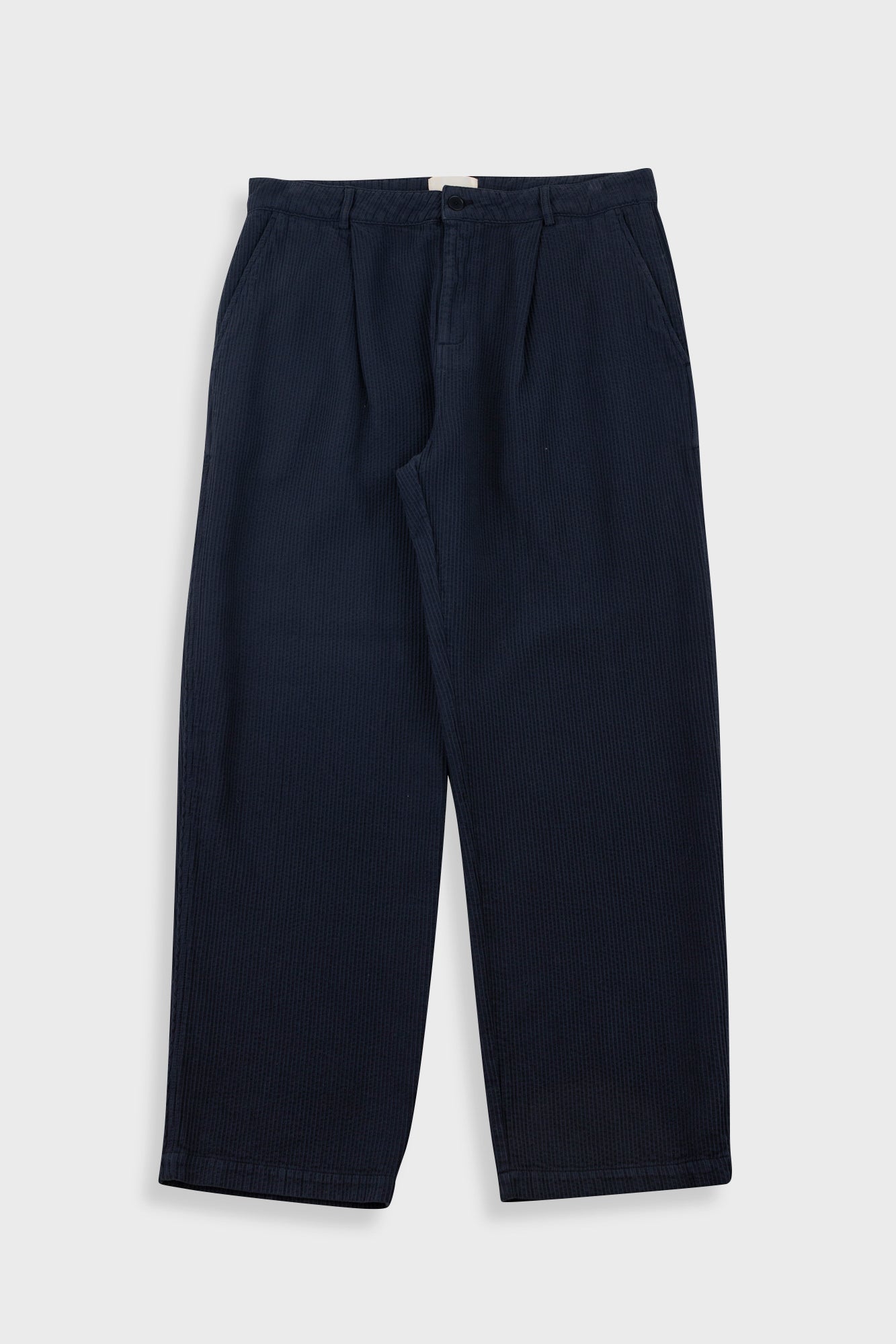 Navy blue pants on a light gray background