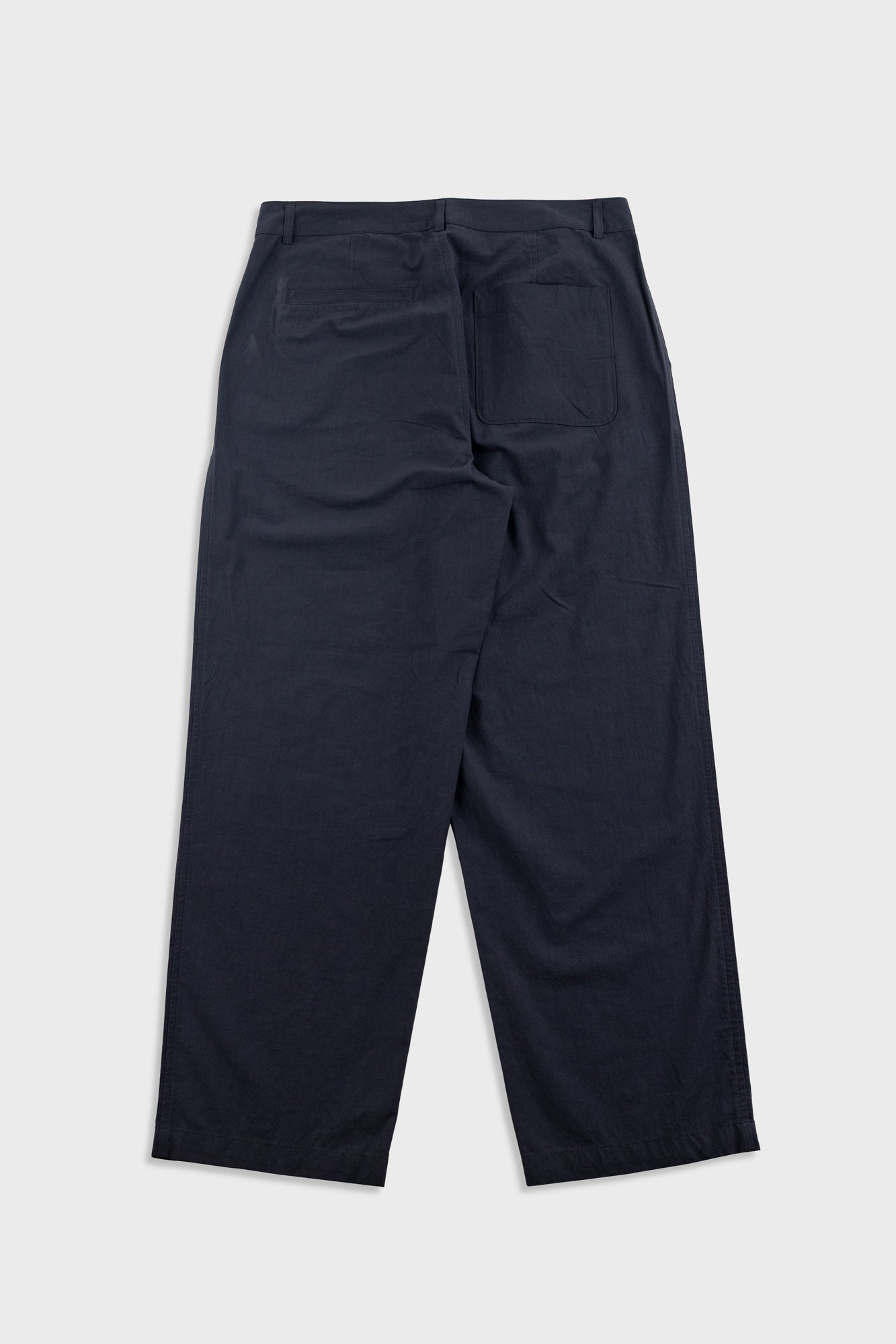 Black pants on a light gray background