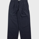Black wide-leg pants on a light gray background