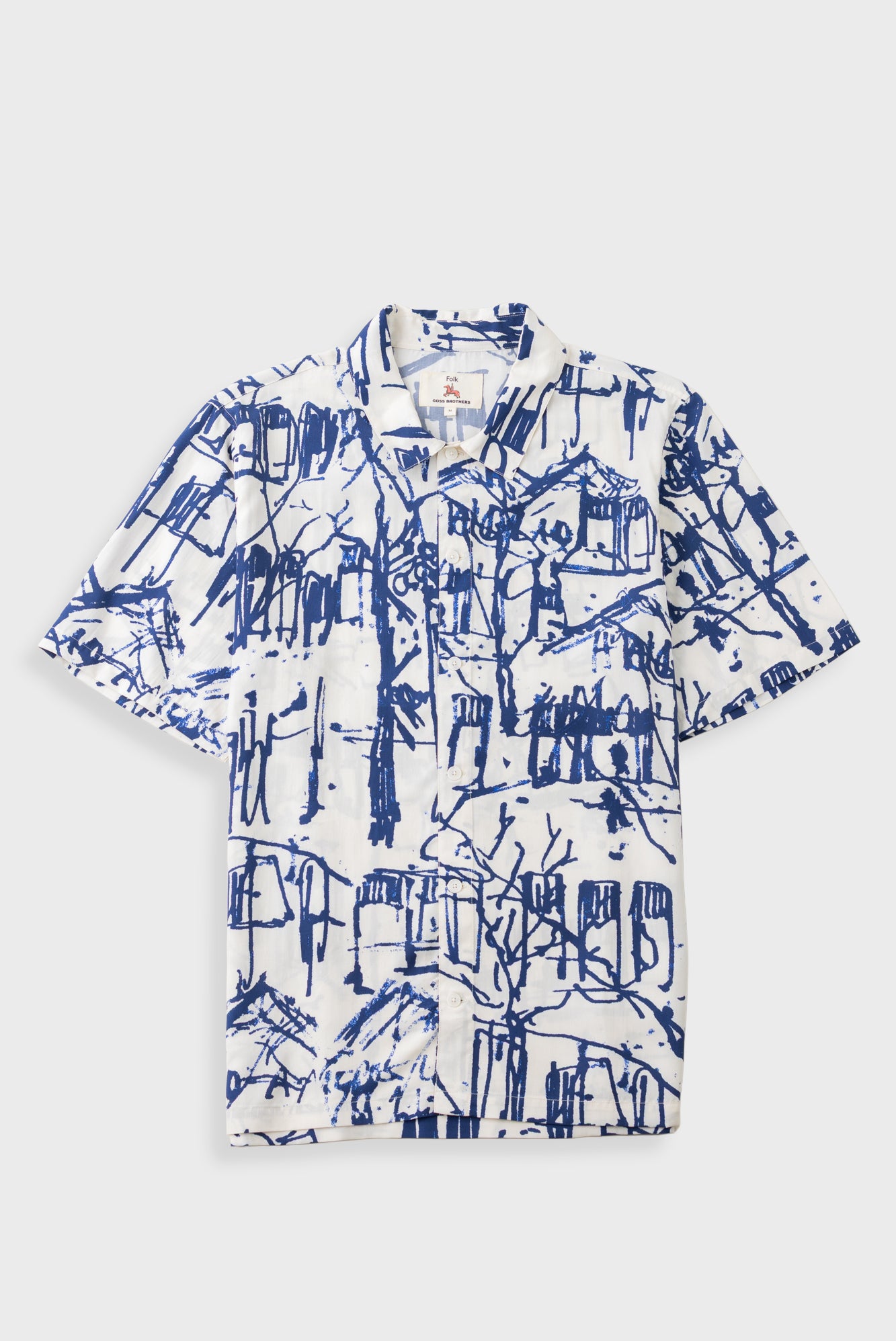 A short-sleeve button-up shirt with a white base and a blue sketch-style architectural print, displayed flat against a light gray background.