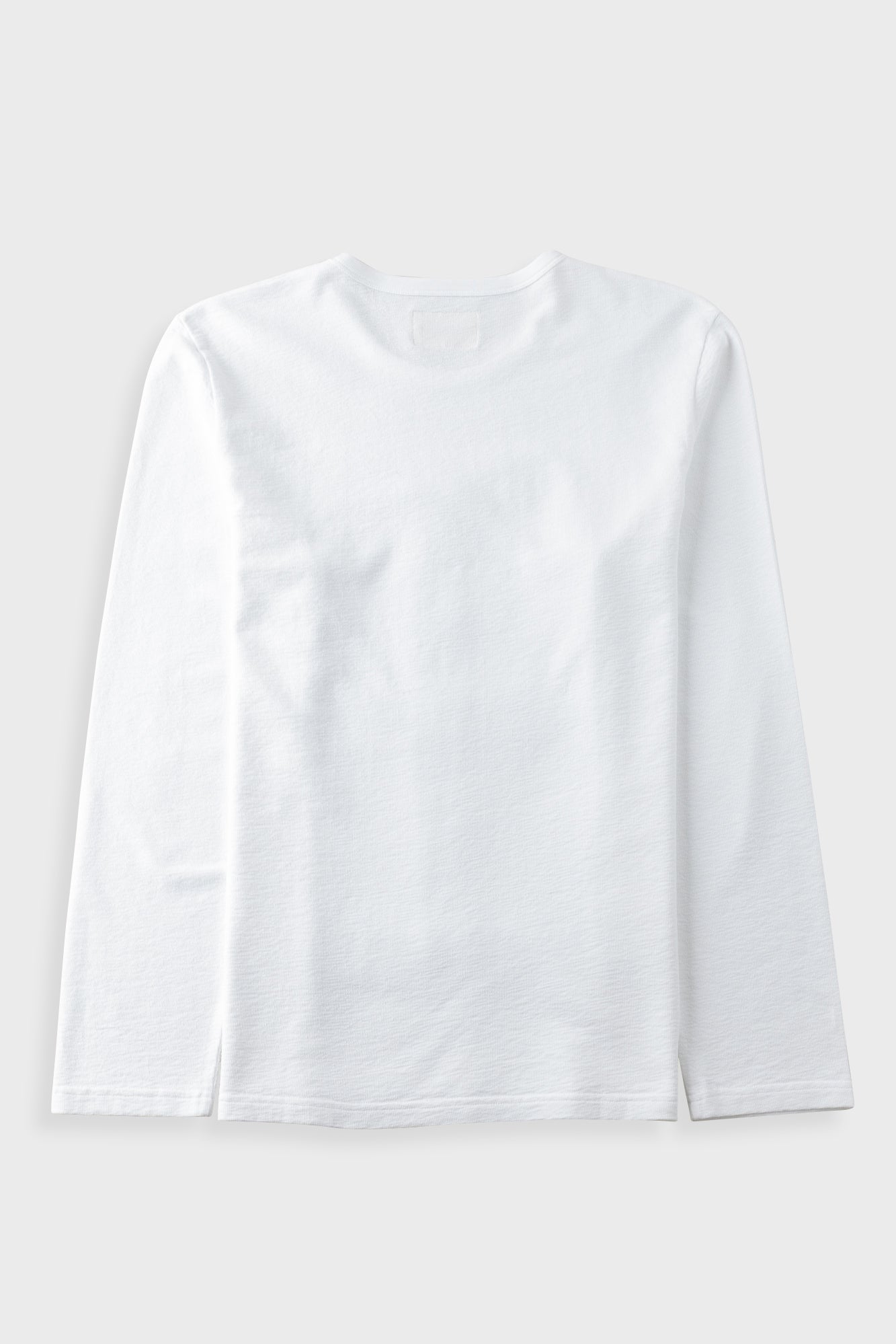 A plain white long-sleeve crewneck t-shirt laid flat against a light gray background.
