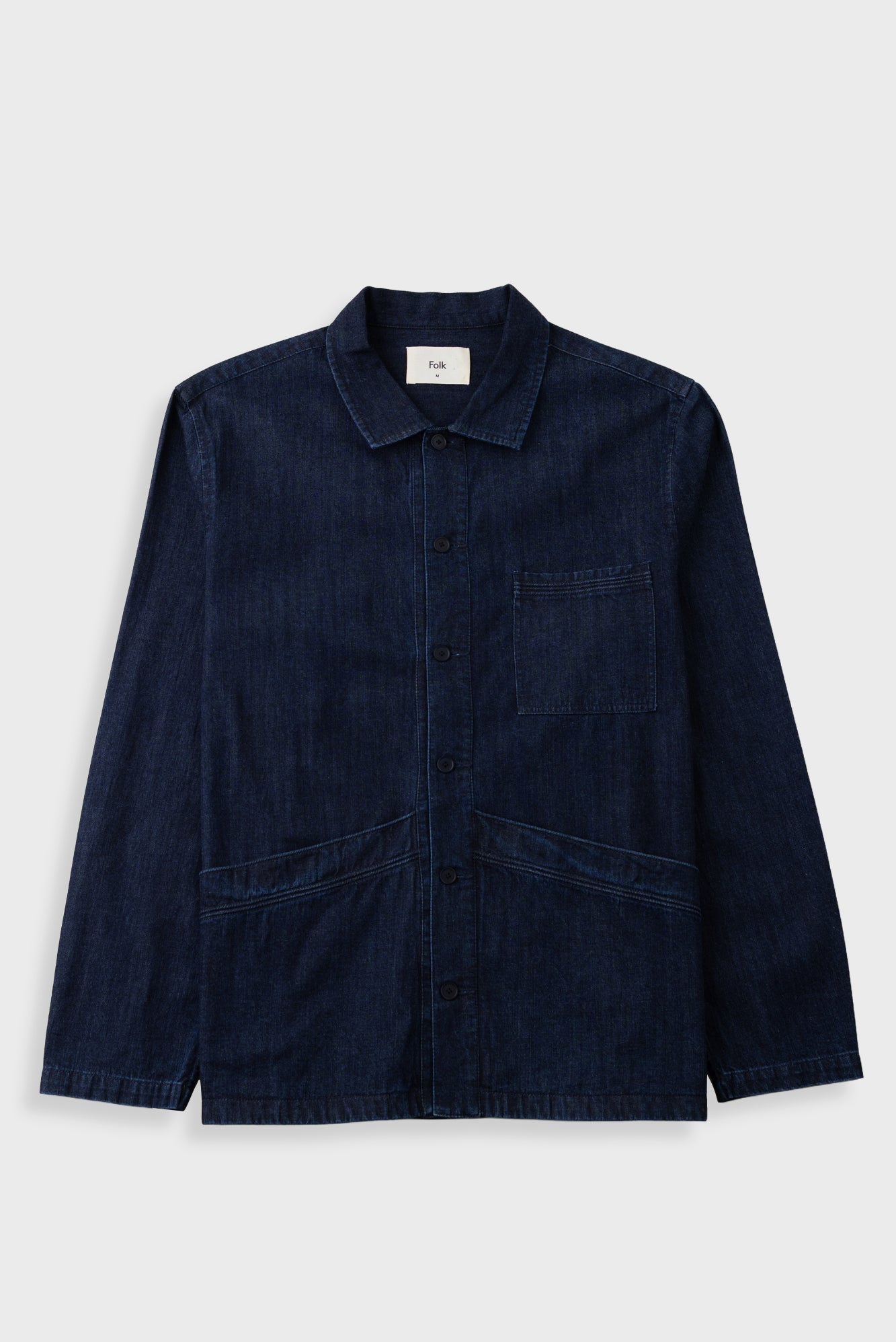 A dark navy blue corduroy utility jacket with a button-up front, collar, and front pockets, displayed flat against a light gray background.