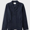 A dark navy blue textured jacket with notch lapels, a three-button front closure, and two front patch pockets, displayed flat against a light gray background.