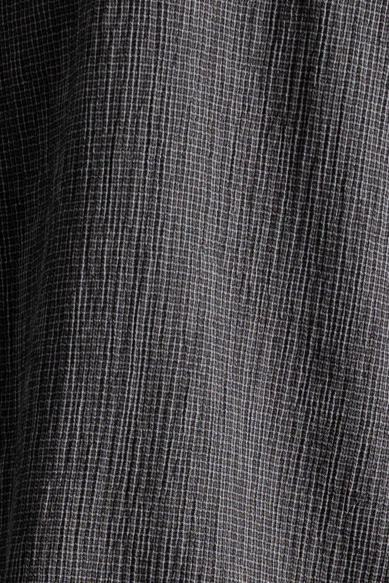 close up of textured black/grey checkered fabric 