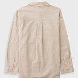 A light beige linen shirt shown from the back, featuring a button-down collar, long sleeves, and a relaxed fit, photographed against a neutral light gray background.
