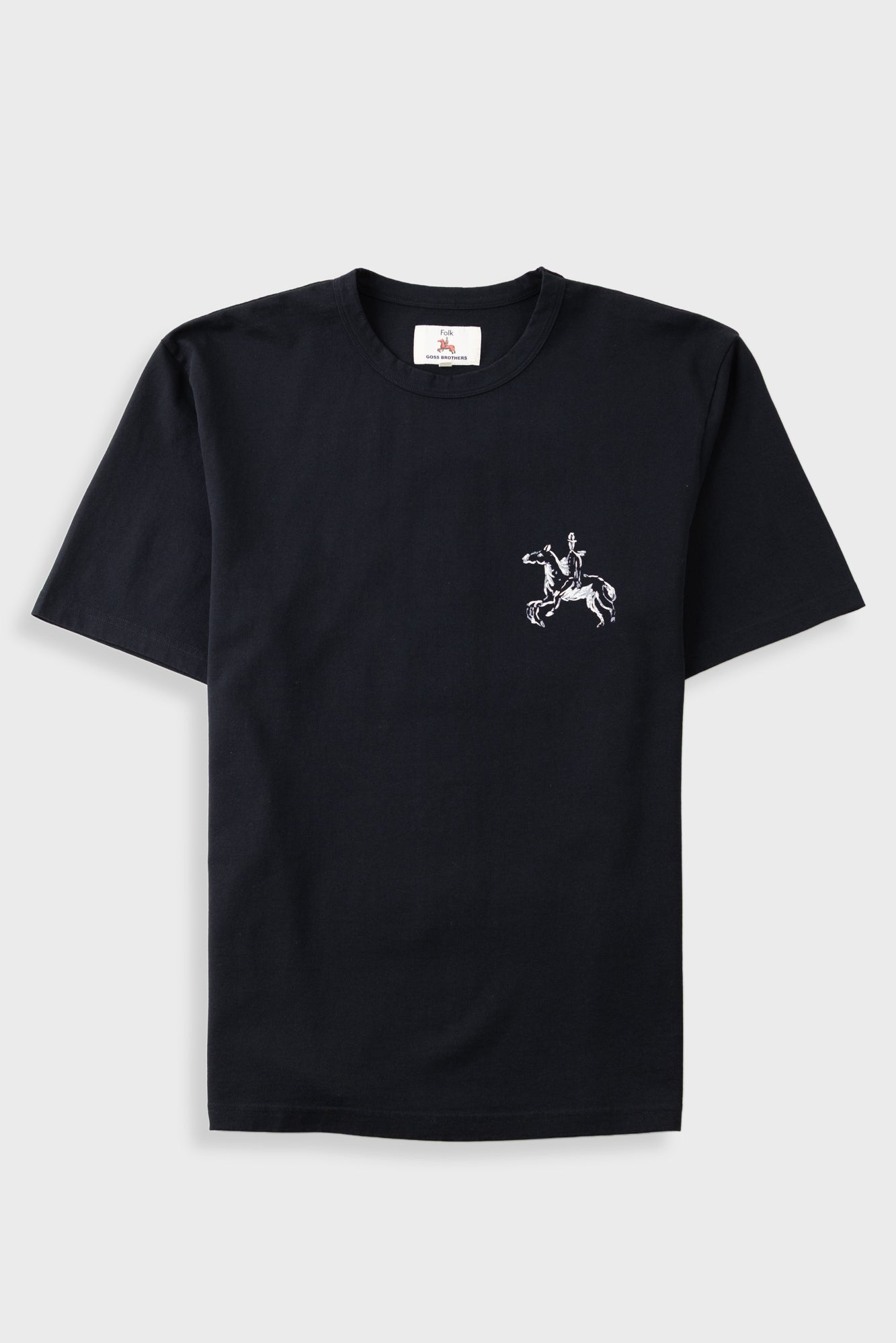 Black t-shirt with white horse logo on left hand chest, laid flat against a light grey background