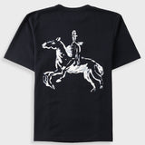 A black short-sleeve t-shirt with a white graphic print of a rider on a rearing horse on the back, displayed against a light gray background.