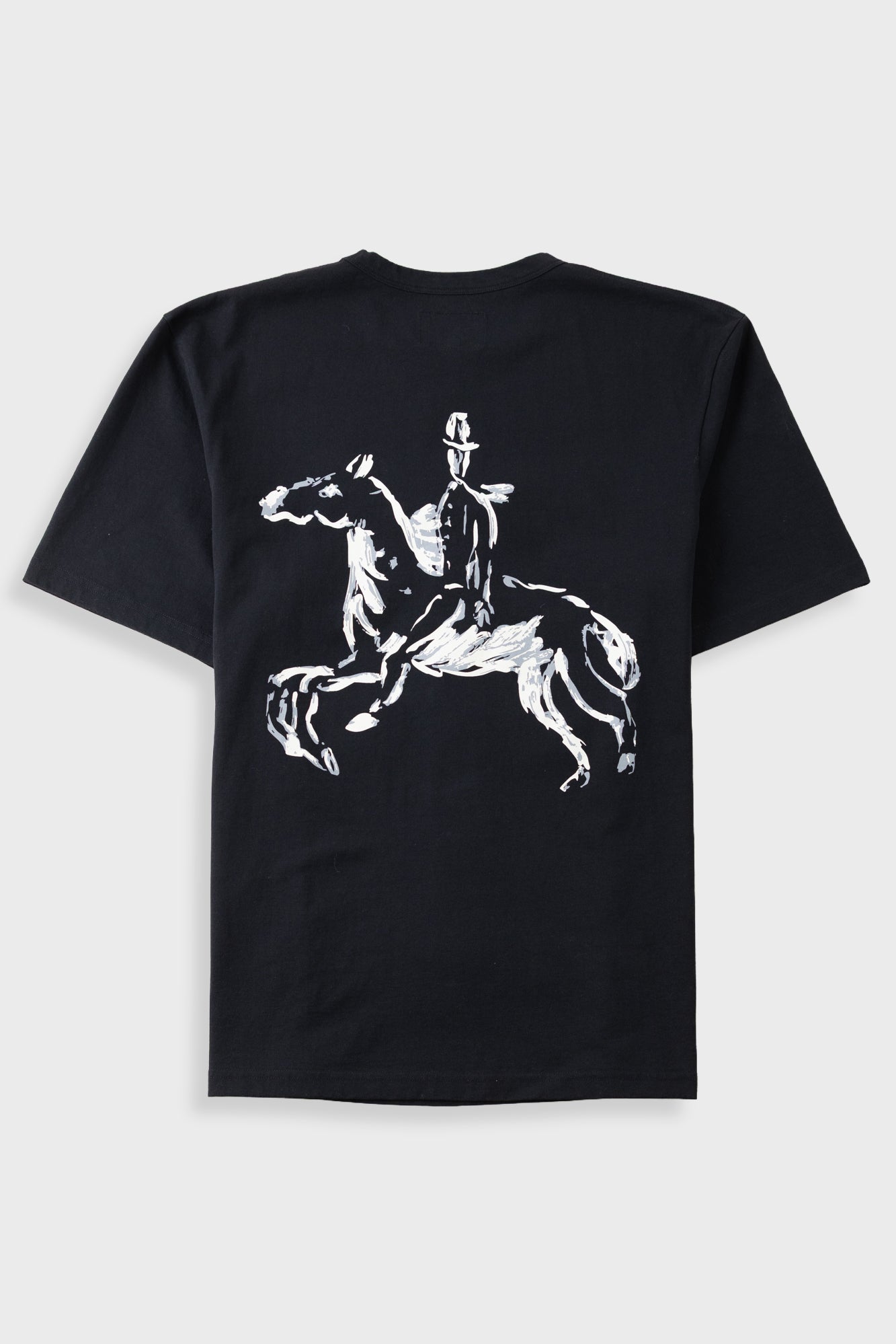 A black short-sleeve t-shirt with a white graphic print of a rider on a rearing horse on the back, displayed against a light gray background.
