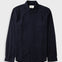A dark navy blue long-sleeve button-up shirt with a single chest pocket, laid flat against a light gray background.