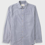 Pale fine striped blue shirt against a grey backdrop