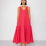 Woman wearing a red dress against a white background