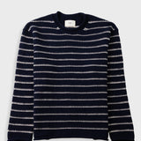 A navy blue crewneck sweater with horizontal white knit stripes, laid flat against a light gray background.
