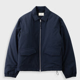 A navy blue lightweight jacket with a full front zipper, a pointed collar, and two large front flap pockets, shown flat on a light gray background.
