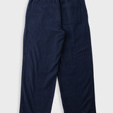 A pair of dark navy blue trousers with a subtle vertical pinstripe pattern, shown from the back on a light gray background.